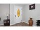 Entryway with white door, wood floors, and decorative vase at 6402 N 45Th Ave, Glendale, AZ 85301