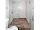 Large walk-in shower with marble tile and glass enclosure at 6402 N 45Th Ave, Glendale, AZ 85301