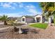 Single story home with landscaped yard and two car garage at 7740 W Calavar Rd, Peoria, AZ 85381