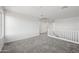 Loft area with grey carpet, window, and white walls at 779 S La Mesa Ct, Casa Grande, AZ 85122