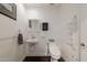 Small bathroom with toilet, sink, and grab bar at 813 E Glendale Ave, Phoenix, AZ 85020