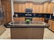 Kitchen boasts granite countertops, an island, and modern appliances at 8605 W Carole Ln, Glendale, AZ 85305