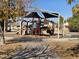 playground with shaded area and play structures at 8605 W Carole Ln, Glendale, AZ 85305