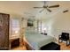 Bright bedroom with wood floors and ceiling fan at 8873 N 114Th Dr, Peoria, AZ 85345