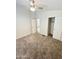 Large bedroom featuring carpet, ceiling fan, and access to another room at 9333 E University Dr # 51, Mesa, AZ 85207