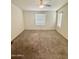 Bright and airy bedroom with carpet and window coverings at 9333 E University Dr # 51, Mesa, AZ 85207