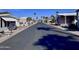 Residential street lined with manufactured homes and palm trees at 9333 E University Dr # 51, Mesa, AZ 85207