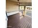 Covered patio with ceiling fan and wood-look flooring at 9333 E University Dr # 51, Mesa, AZ 85207