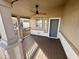 Covered patio with ceiling fan and gray door at 9333 E University Dr # 51, Mesa, AZ 85207