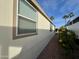 Side view of manufactured home with yellow flowers at 9333 E University Dr # 51, Mesa, AZ 85207