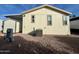 Rear view of manufactured home with shed and AC unit at 9333 E University Dr # 51, Mesa, AZ 85207