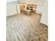 Open kitchen with island, stainless steel appliances, and light wood cabinets at 9333 E University Dr # 51, Mesa, AZ 85207