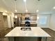 Open kitchen with island and stainless steel appliances at 9333 E University Dr # 51, Mesa, AZ 85207