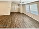 Bright living room featuring wood-look floors and neutral walls at 9333 E University Dr # 51, Mesa, AZ 85207
