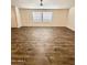 Spacious living room with wood-look floors and neutral color scheme at 9333 E University Dr # 51, Mesa, AZ 85207