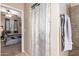 Bathroom with shower, linen closet, and view into bedroom at 10136 E Southern Ave # 2089, Mesa, AZ 85209