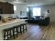 Open concept kitchen and living area with hardwood floors and modern furniture at 11900 N 32Nd St # 2, Phoenix, AZ 85028