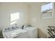 Bright laundry room with Whirlpool washer and dryer at 11900 N 32Nd St # 2, Phoenix, AZ 85028