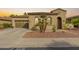 Single-story home with desert landscaping and two-car garage at 12448 W Rosewood Ln, Peoria, AZ 85383