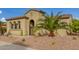 Front view of single story home with palm trees and landscaping at 12448 W Rosewood Ln, Peoria, AZ 85383