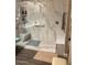 Spacious walk-in shower with marble walls and built-in seat at 13640 W Paso Trl, Peoria, AZ 85383