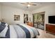 Bright bedroom with a king-size bed and access to a private balcony at 15050 N Thompson Peak Pkwy # 2053, Scottsdale, AZ 85260