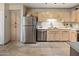Kitchen with stainless steel appliances, light wood cabinets, and tile flooring at 15050 N Thompson Peak Pkwy # 2053, Scottsdale, AZ 85260