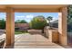 Covered patio with built-in grill and seating area at 18075 W Browning Dr, Surprise, AZ 85374