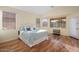 Spacious main bedroom with wood floors and backyard access at 18075 W Browning Dr, Surprise, AZ 85374