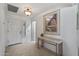 Bright entryway with tile flooring, a console table, and large wall art at 19236 N 93Rd N Ave, Peoria, AZ 85382