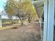 Large backyard with mature trees and a patio area at 2127 E Bayberry Ave, Mesa, AZ 85204