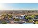 Aerial view of a single-story house with a large backyard and a circular driveway at 23628 N 105Th Ln, Peoria, AZ 85383