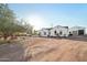 House exterior with circular driveway and mature trees at 23628 N 105Th Ln, Peoria, AZ 85383