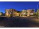 Night view of a stucco home with landscaping and lighting at 25803 N 8Th Ave, Phoenix, AZ 85085