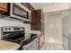 Kitchen area with stainless steel appliances and wood cabinets at 3031 N Civic Center Plz # 224, Scottsdale, AZ 85251