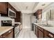 Modern kitchen with stainless steel appliances and wood cabinets at 3031 N Civic Center Plz # 224, Scottsdale, AZ 85251