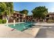 Community pool with surrounding lounge chairs at 3031 N Civic Center Plz # 224, Scottsdale, AZ 85251