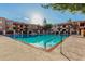 Community swimming pool with lounge chairs at 3031 N Civic Center Plz # 224, Scottsdale, AZ 85251