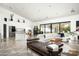 Open living space with white walls, sliding doors to backyard at 329 E Belmont Ave, Phoenix, AZ 85020