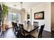 Bright dining room features a large wooden table with six chairs and hardwood floors at 3937 E Taurus Pl, Chandler, AZ 85249