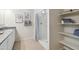 Bathroom with shower and linen shelving at 40030 W Venture Rd, Maricopa, AZ 85138
