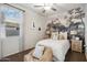 Bedroom with scenic wall mural and ceiling fan at 40030 W Venture Rd, Maricopa, AZ 85138