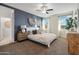 Spacious bedroom with a ceiling fan and large windows at 40030 W Venture Rd, Maricopa, AZ 85138