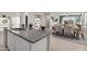 Island kitchen with granite countertops and open concept layout at 40030 W Venture Rd, Maricopa, AZ 85138