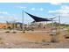 Modern playground with shade structures and play equipment at 40030 W Venture Rd, Maricopa, AZ 85138