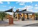 Modern playground with shaded areas and play structures at 40030 W Venture Rd, Maricopa, AZ 85138