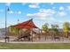 playground with shade structures, slides, and swings at 40030 W Venture Rd, Maricopa, AZ 85138