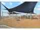 Playground with shade structures and climbing equipment at 40030 W Venture Rd, Maricopa, AZ 85138