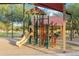 Shaded playground with climbing structures and slide at 40030 W Venture Rd, Maricopa, AZ 85138