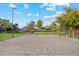 Sand volleyball court with surrounding landscaping at 40030 W Venture Rd, Maricopa, AZ 85138